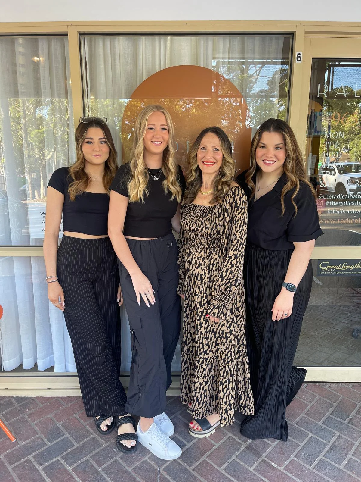 Four members of the Radical Hair team outside the Dural salon